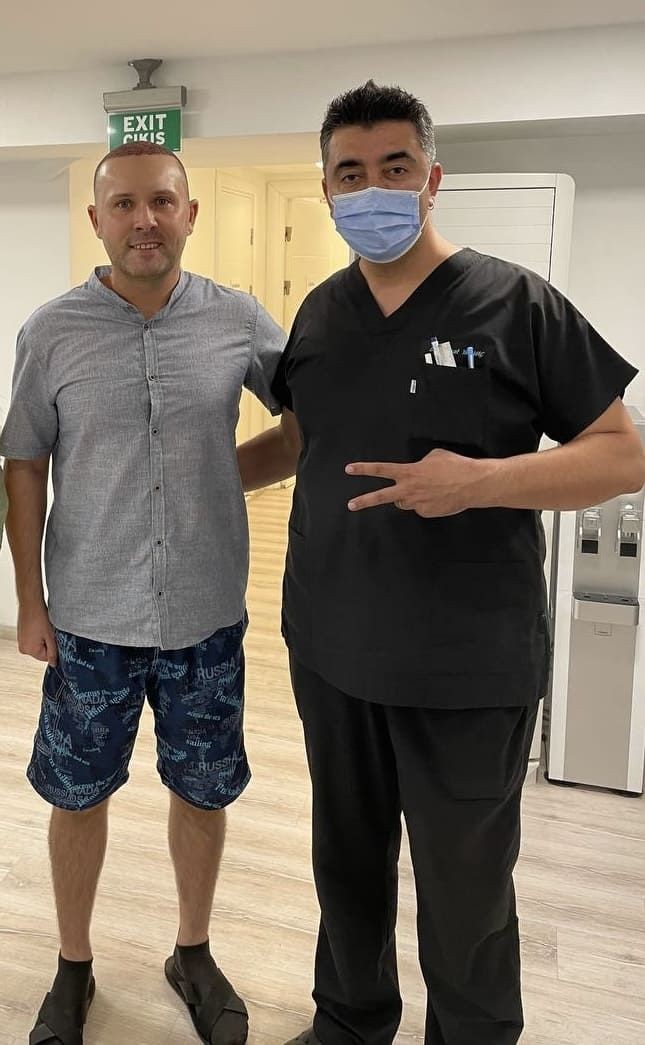 Hair Transplant surgeon with a patient 